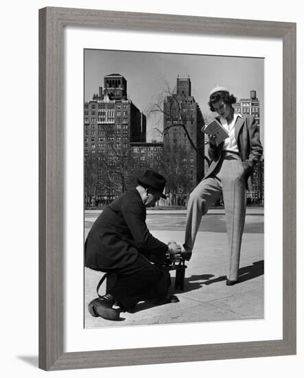 Model Showing Off Slacks as She Reads a First Aid Text Book in Washington Square Park-Nina Leen-Framed Photographic Print