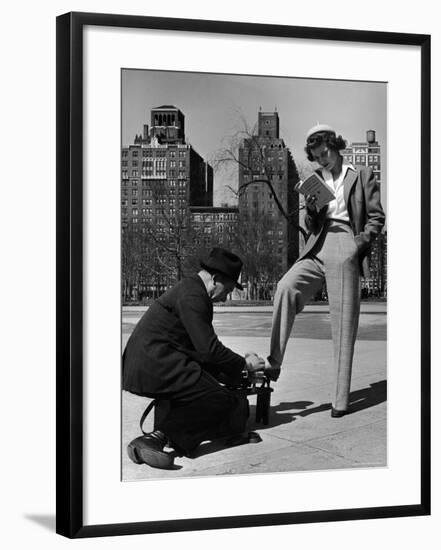 Model Showing Off Slacks as She Reads a First Aid Text Book in Washington Square Park-Nina Leen-Framed Photographic Print