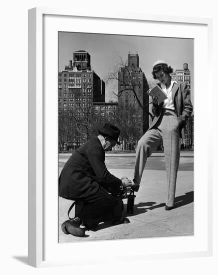 Model Showing Off Slacks as She Reads a First Aid Text Book in Washington Square Park-Nina Leen-Framed Photographic Print