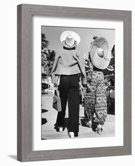 Model Stephanie Nikashian in Cartwheel Straw Hat and Flower Print Turkish Trousers-Alfred Eisenstaedt-Framed Photographic Print