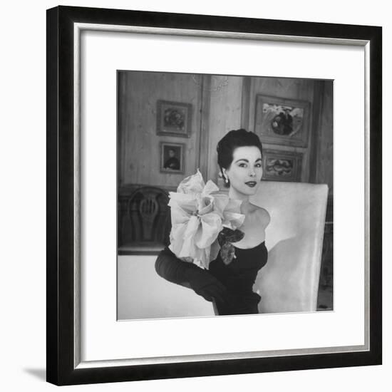 Model Wearing a Flowery Dress While Peering Into the Distance-Nina Leen-Framed Photographic Print