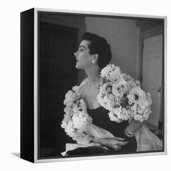 Model Wearing a Flowery Dress While Peering Into the Distance-Nina Leen-Framed Premier Image Canvas