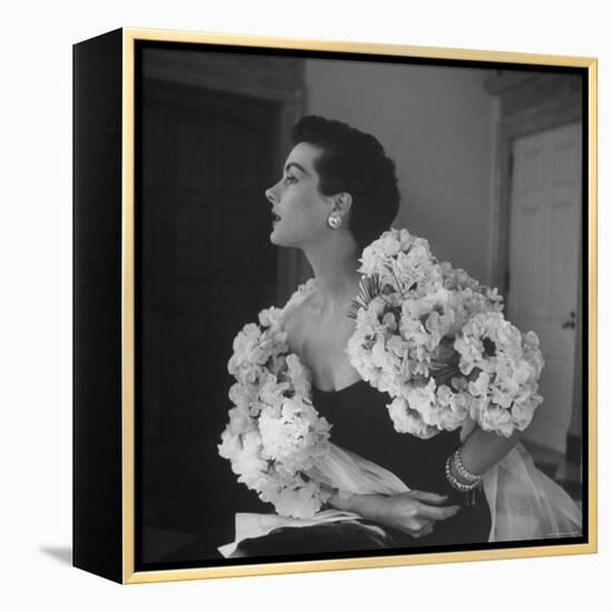 Model Wearing a Flowery Dress While Peering Into the Distance-Nina Leen-Framed Premier Image Canvas