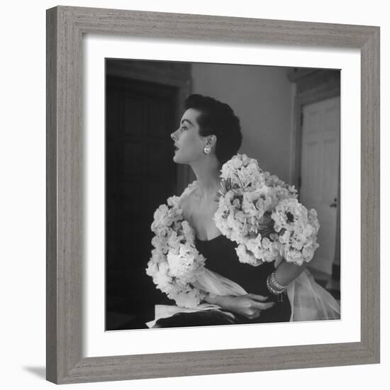 Model Wearing a Flowery Dress While Peering Into the Distance-Nina Leen-Framed Photographic Print