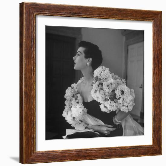 Model Wearing a Flowery Dress While Peering Into the Distance-Nina Leen-Framed Photographic Print