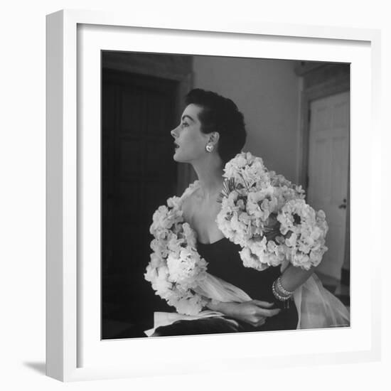 Model Wearing a Flowery Dress While Peering Into the Distance-Nina Leen-Framed Photographic Print