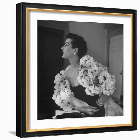 Model Wearing a Flowery Dress While Peering Into the Distance-Nina Leen-Framed Photographic Print