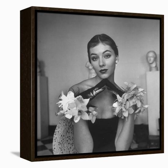 Model Wearing a Flowery Glove While Peering Into the Distance-Nina Leen-Framed Premier Image Canvas