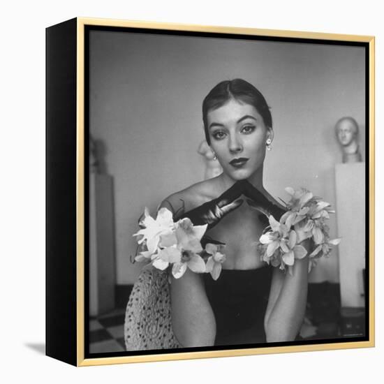 Model Wearing a Flowery Glove While Peering Into the Distance-Nina Leen-Framed Premier Image Canvas