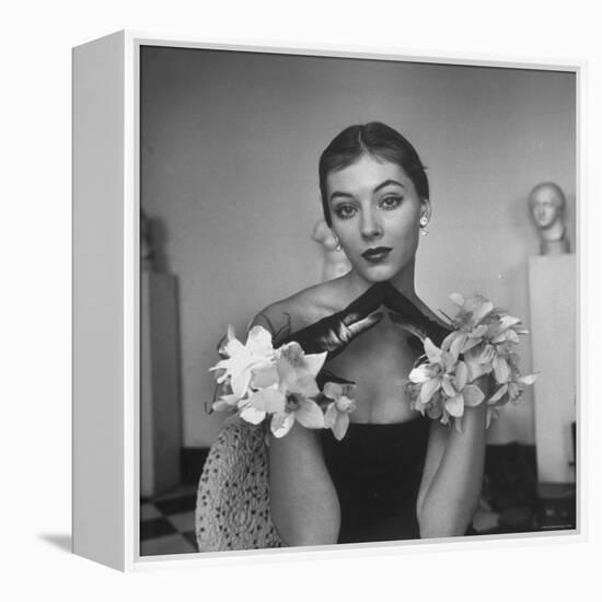 Model Wearing a Flowery Glove While Peering Into the Distance-Nina Leen-Framed Premier Image Canvas