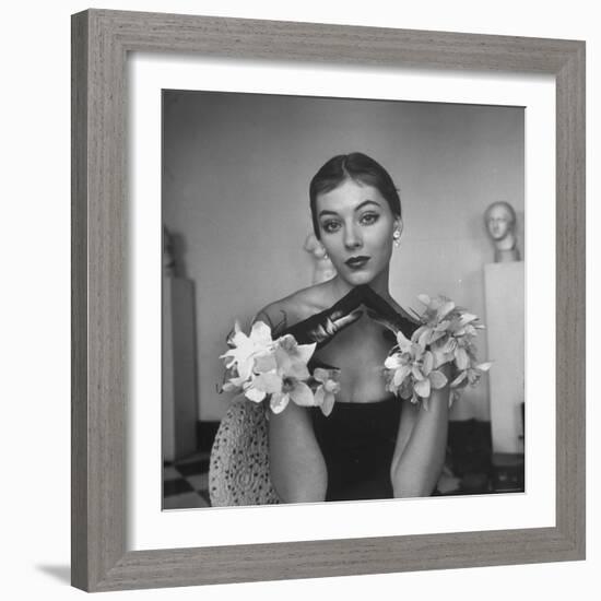 Model Wearing a Flowery Glove While Peering Into the Distance-Nina Leen-Framed Photographic Print