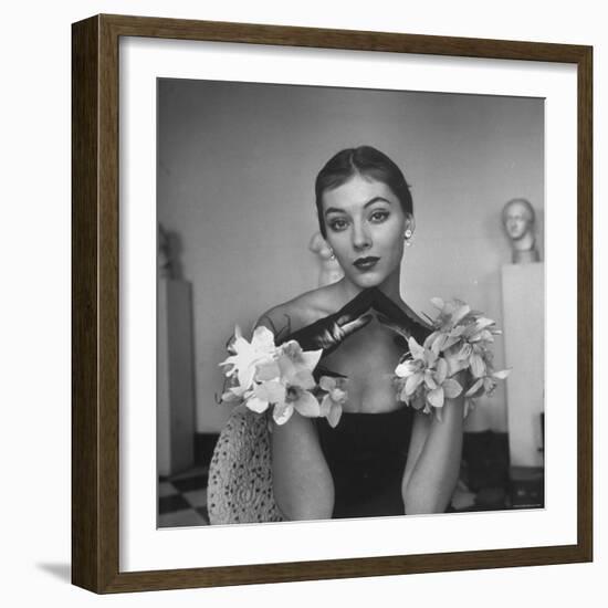 Model Wearing a Flowery Glove While Peering Into the Distance-Nina Leen-Framed Photographic Print