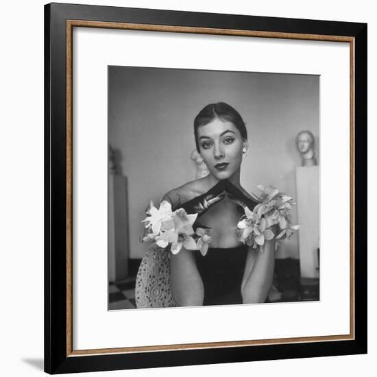 Model Wearing a Flowery Glove While Peering Into the Distance-Nina Leen-Framed Photographic Print