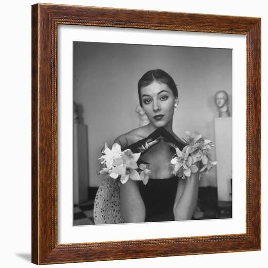 Model Wearing a Flowery Glove While Peering Into the Distance-Nina Leen-Framed Photographic Print