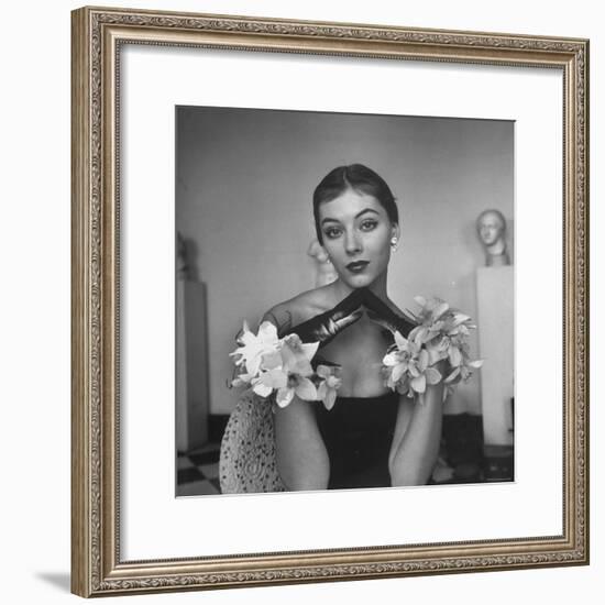 Model Wearing a Flowery Glove While Peering Into the Distance-Nina Leen-Framed Photographic Print