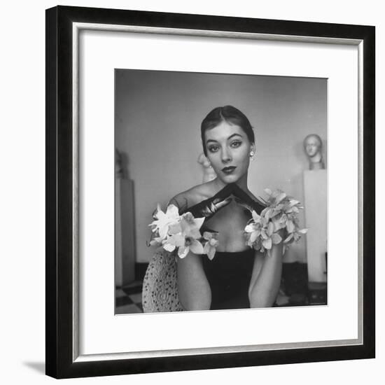 Model Wearing a Flowery Glove While Peering Into the Distance-Nina Leen-Framed Photographic Print