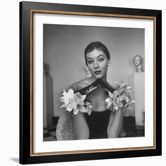 Model Wearing a Flowery Glove While Peering Into the Distance-Nina Leen-Framed Photographic Print