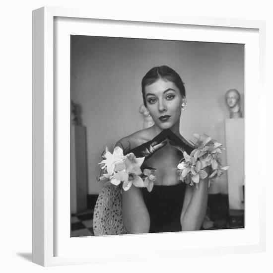 Model Wearing a Flowery Glove While Peering Into the Distance-Nina Leen-Framed Photographic Print