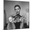 Model Wearing a Flowery Glove While Peering Into the Distance-Nina Leen-Mounted Photographic Print