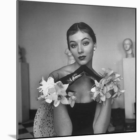 Model Wearing a Flowery Glove While Peering Into the Distance-Nina Leen-Mounted Photographic Print