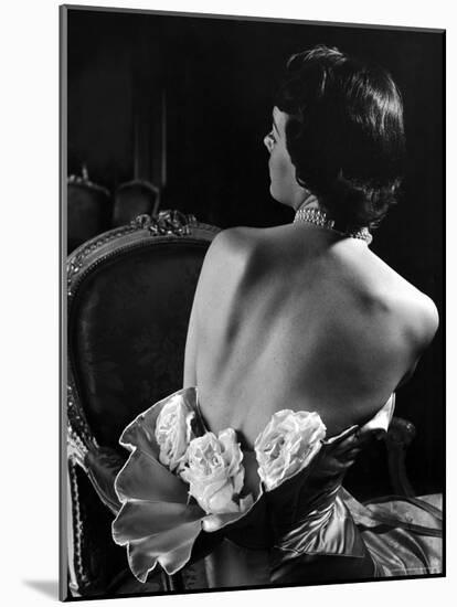 Model Wearing Mother of Pearl Satin Gown with roses tucked in waist by Balmain-Nina Leen-Mounted Photographic Print
