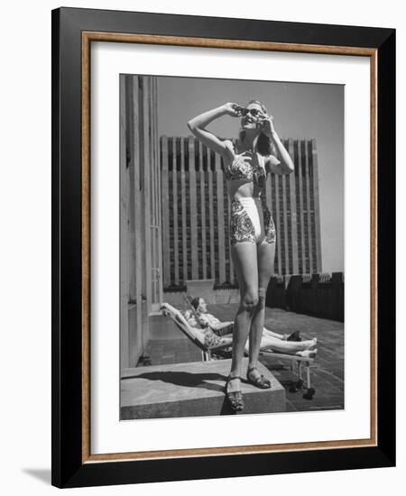 Model Wearing Sunglasses and Swim Suit Sunbathing on Roof of Rockefeller Center-Alfred Eisenstaedt-Framed Photographic Print