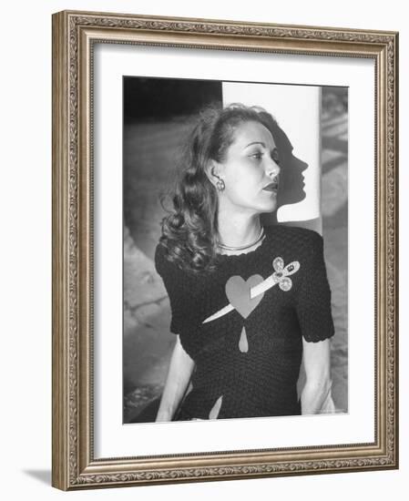 Model Wearing Sweater with Heart Pierced by Jeweled Dagger-Nina Leen-Framed Photographic Print