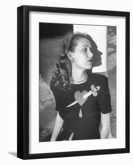 Model Wearing Sweater with Heart Pierced by Jeweled Dagger-Nina Leen-Framed Photographic Print