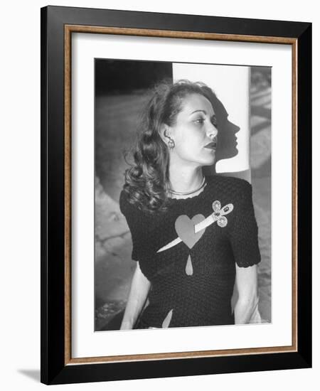 Model Wearing Sweater with Heart Pierced by Jeweled Dagger-Nina Leen-Framed Photographic Print