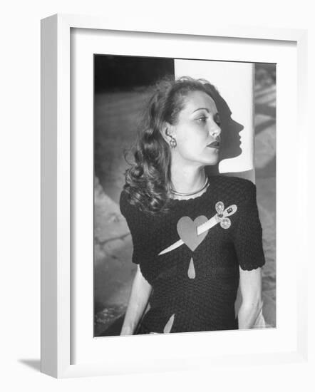 Model Wearing Sweater with Heart Pierced by Jeweled Dagger-Nina Leen-Framed Photographic Print