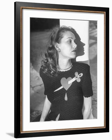 Model Wearing Sweater with Heart Pierced by Jeweled Dagger-Nina Leen-Framed Photographic Print