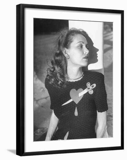 Model Wearing Sweater with Heart Pierced by Jeweled Dagger-Nina Leen-Framed Photographic Print