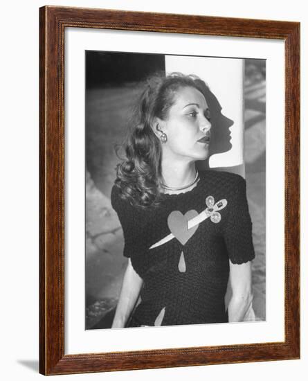 Model Wearing Sweater with Heart Pierced by Jeweled Dagger-Nina Leen-Framed Photographic Print