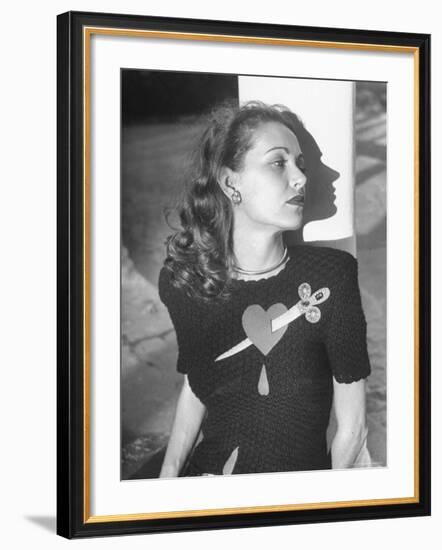 Model Wearing Sweater with Heart Pierced by Jeweled Dagger-Nina Leen-Framed Photographic Print