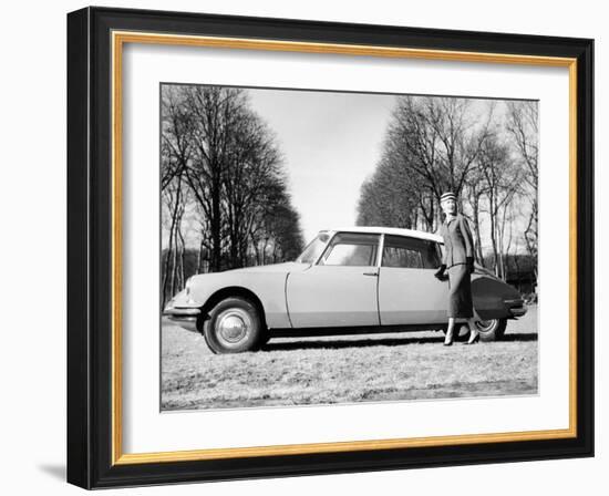 Model with a 1957 Citroën Id 19, C1957-null-Framed Premium Photographic Print