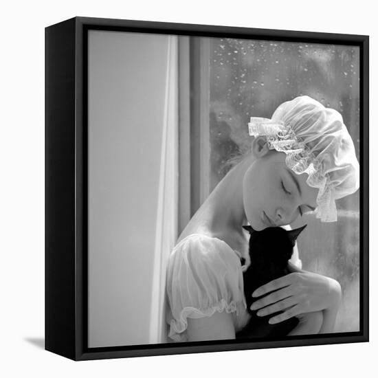 Model with Cap Embracing a Cat, 1960s-John French-Framed Premier Image Canvas