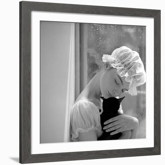 Model with Cap Embracing a Cat, 1960s-John French-Framed Giclee Print