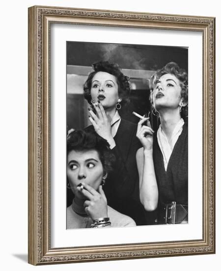 Models Exhaling Elegantly, Learning Proper Cigarette Smoking Technique in Practice For TV Ad-Peter Stackpole-Framed Photographic Print