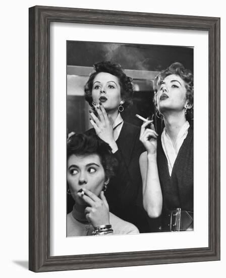 Models Exhaling Elegantly, Learning Proper Cigarette Smoking Technique in Practice For TV Ad-Peter Stackpole-Framed Photographic Print