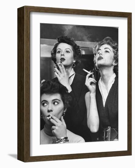 Models Exhaling Elegantly, Learning Proper Cigarette Smoking Technique in Practice For TV Ad-Peter Stackpole-Framed Photographic Print