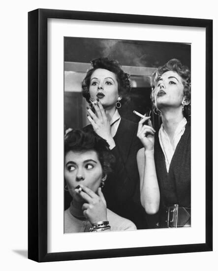 Models Exhaling Elegantly, Learning Proper Cigarette Smoking Technique in Practice For TV Ad-Peter Stackpole-Framed Photographic Print