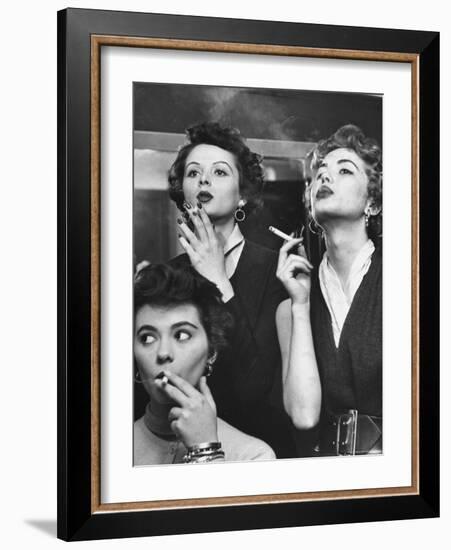 Models Exhaling Elegantly, Learning Proper Cigarette Smoking Technique in Practice For TV Ad-Peter Stackpole-Framed Photographic Print