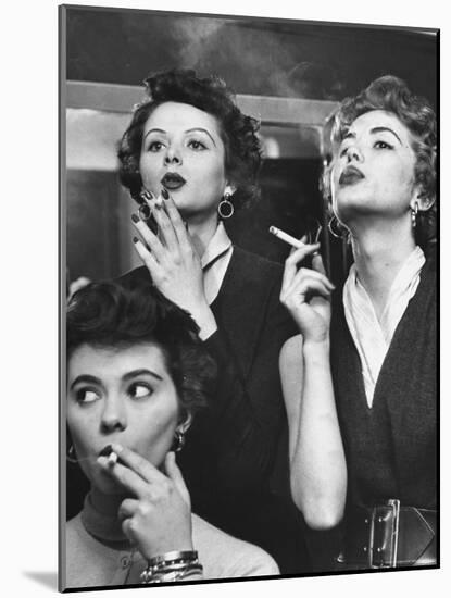 Models Exhaling Elegantly, Learning Proper Cigarette Smoking Technique in Practice For TV Ad-Peter Stackpole-Mounted Photographic Print