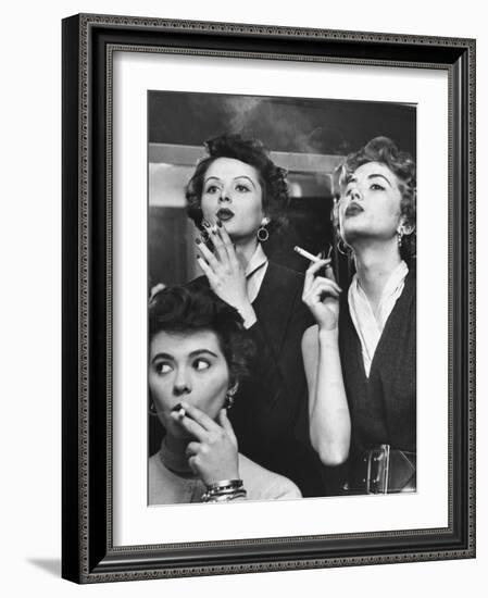 Models Exhaling Elegantly, Learning Proper Cigarette Smoking Technique in Practice For TV Ad-Peter Stackpole-Framed Photographic Print