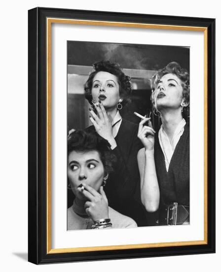 Models Exhaling Elegantly, Learning Proper Cigarette Smoking Technique in Practice For TV Ad-Peter Stackpole-Framed Photographic Print