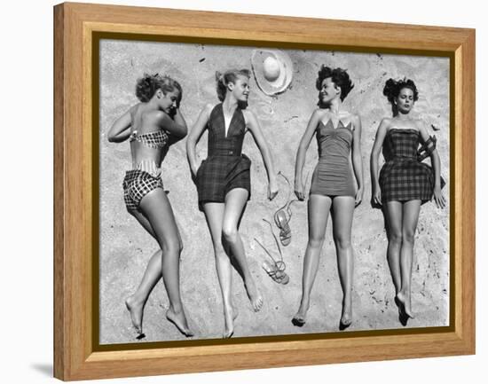 Models Lying on Beach to Display Bathing Suits-Nina Leen-Framed Premier Image Canvas