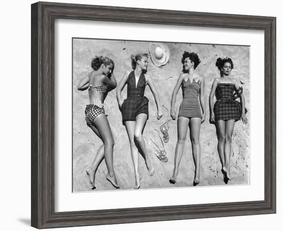 Models Lying on Beach to Display Bathing Suits-Nina Leen-Framed Photographic Print