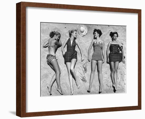 Models Lying on Beach to Display Bathing Suits-Nina Leen-Framed Photographic Print