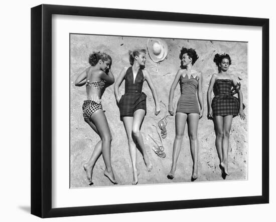 Models Lying on Beach to Display Bathing Suits-Nina Leen-Framed Photographic Print