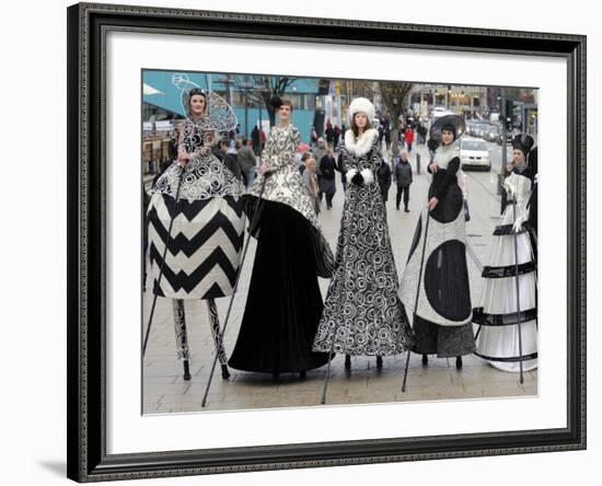 Models on Stilts Present "High Fashion" on the Famous "Jungfernstieg" Boulevard in Hamburg, Germany-null-Framed Photographic Print